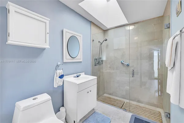 a bathroom with a sink a mirror and a bathtub