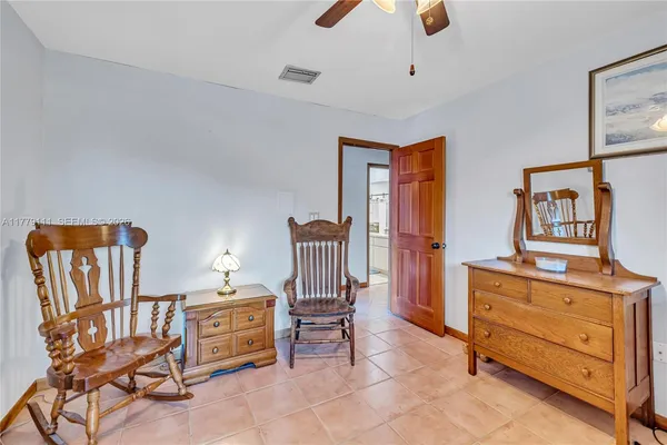 a view of a backyard with a swimming pool