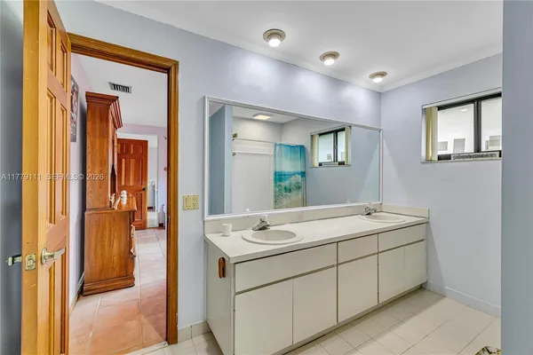 a view of a backyard with swimming pool