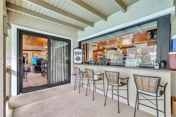 a view of a backyard with swimming pool