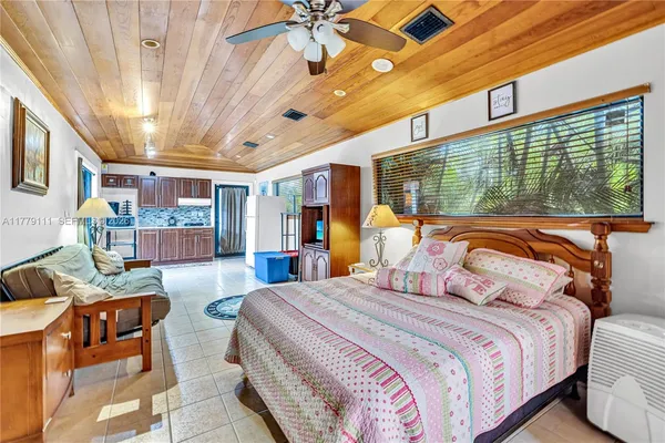 an aerial view of a house with a yard and plants