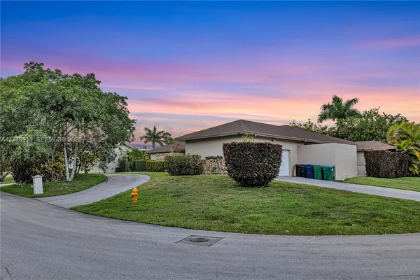 a view of a backyard with a patio and a patio