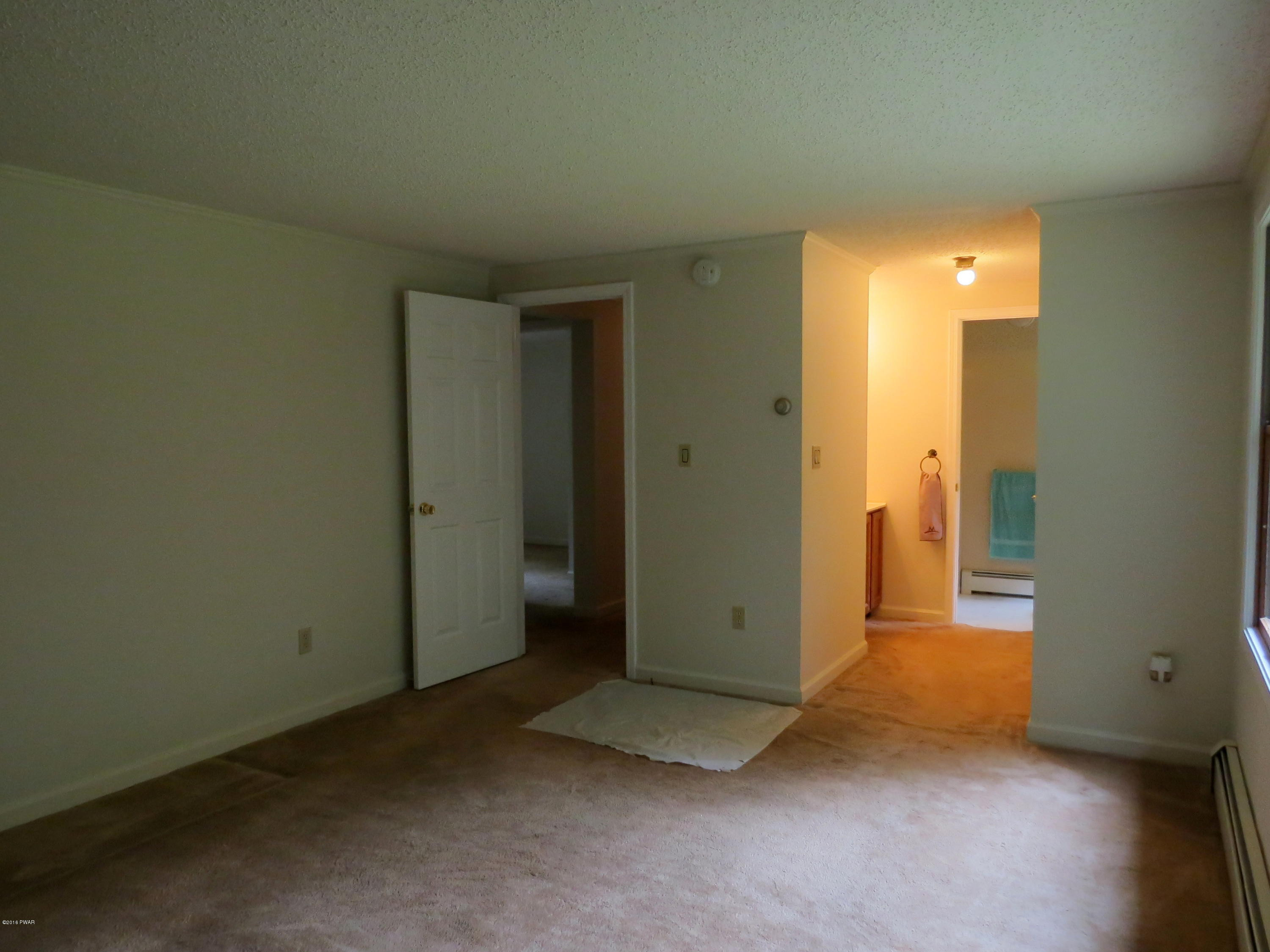 124 Pine Road Hawley, PA 18428 - Photo 14 of 46 master bedroom to bath