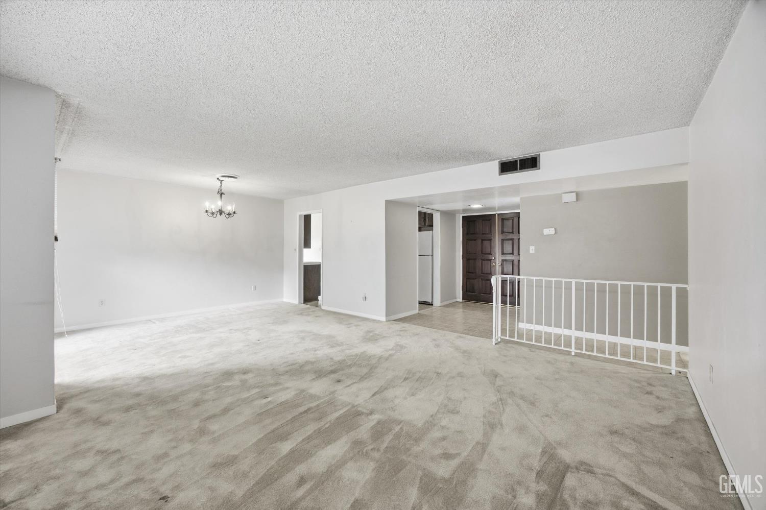 Undisclosed Address Bakersfield, CA 93309 - Photo 21 of 41 a view of a big room with wooden floor and windows