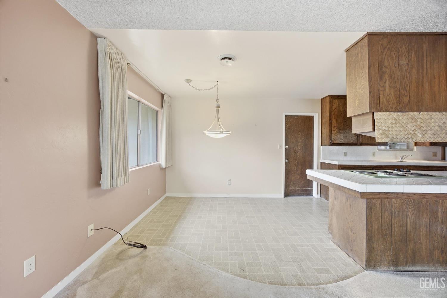 Undisclosed Address Bakersfield, CA 93309 - Photo 29 of 41 a kitchen with a stove a sink and a refrigerator