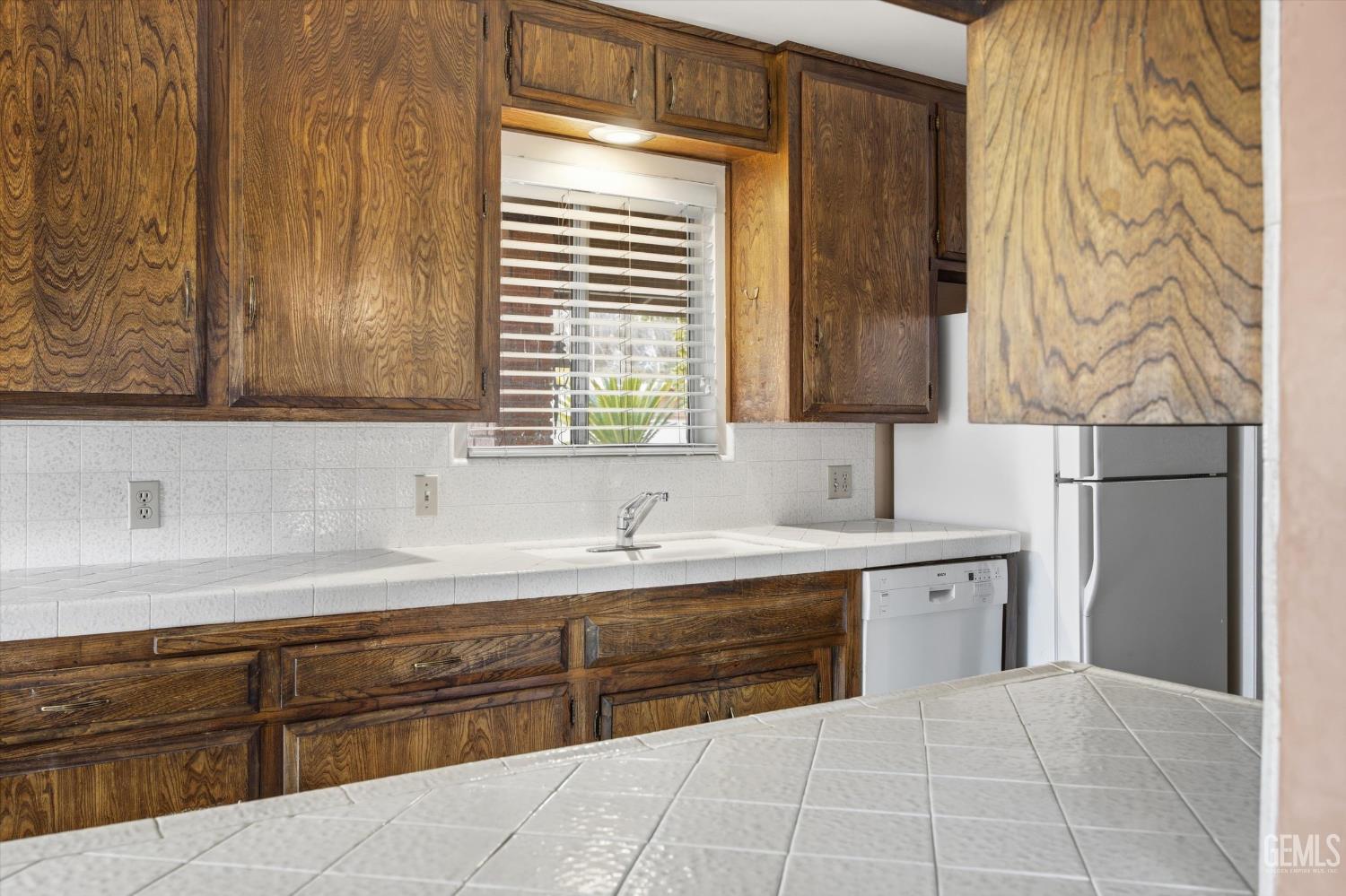 Undisclosed Address Bakersfield, CA 93309 - Photo 32 of 41 a kitchen with stainless steel appliances granite countertop a sink and a refrigerator