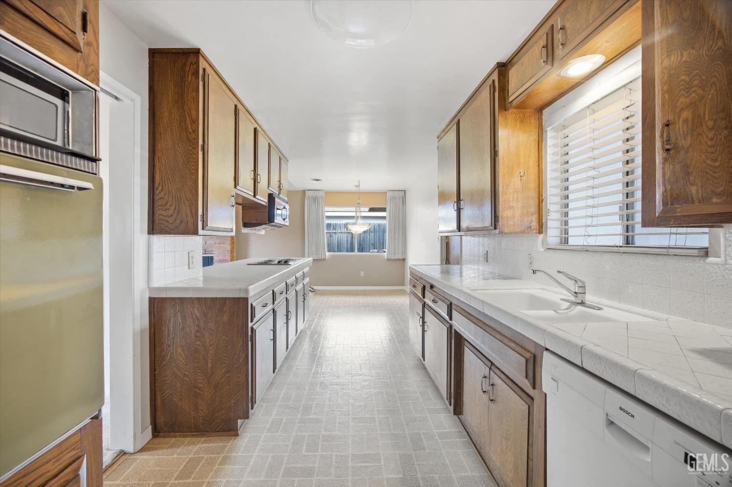 Undisclosed Address Bakersfield, CA 93309 - Photo 35 of 41 a kitchen with a sink and a refrigerator