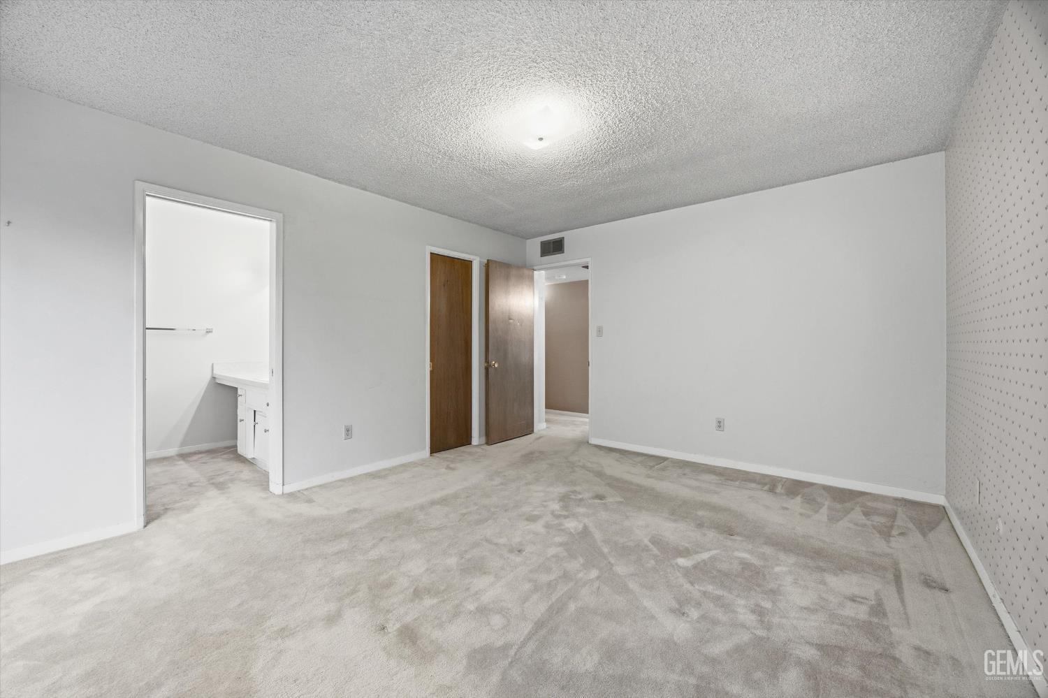 Undisclosed Address Bakersfield, CA 93309 - Photo 38 of 41 an empty room with an entryway