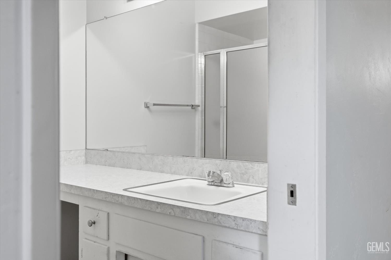 Undisclosed Address Bakersfield, CA 93309 - Photo 39 of 41 a bathroom with a sink and a mirror