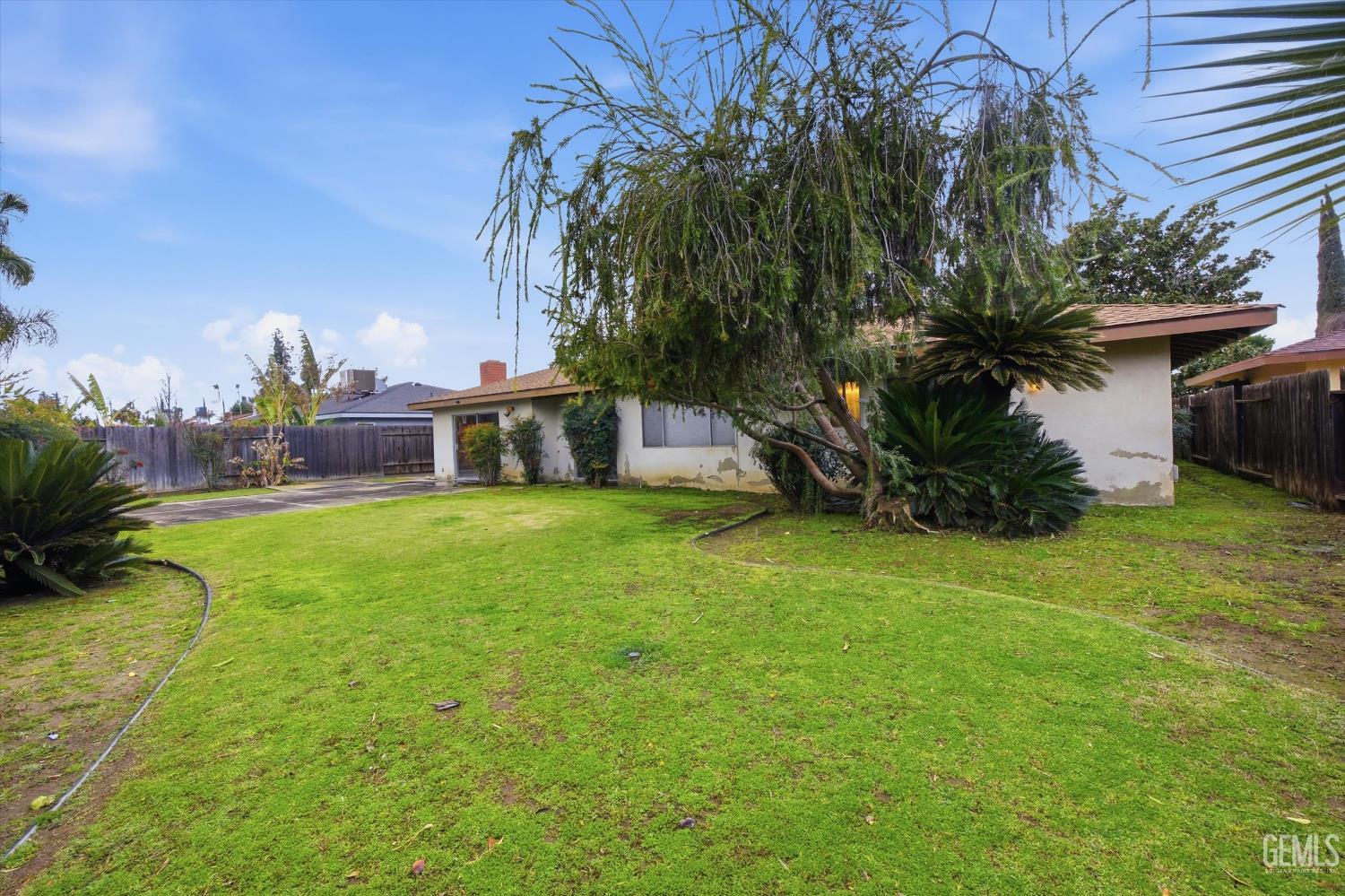 Undisclosed Address Bakersfield, CA 93309 - Photo 6 of 41 a house view with a garden space