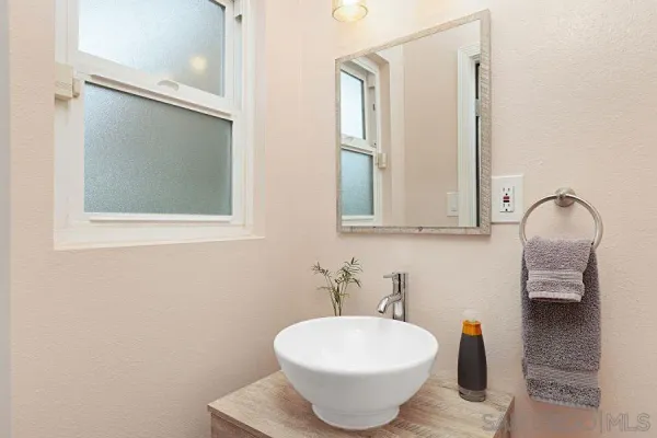 a bathroom with a sink and a mirror