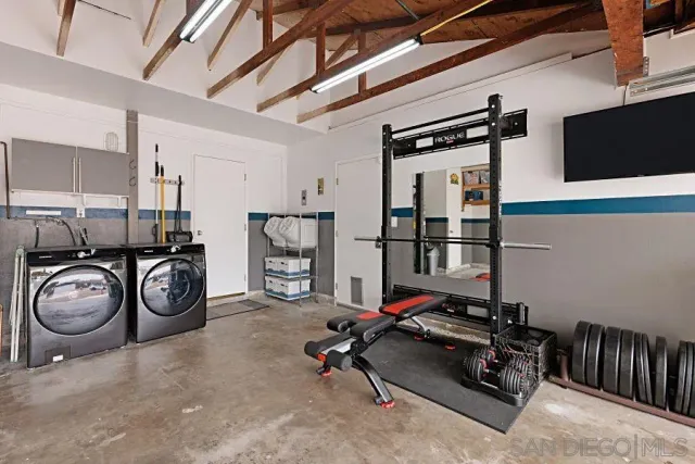 a view of storage and utility room with clothes shoes dryer and bicycles