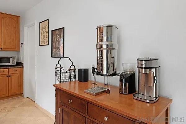 a kitchen with sink a counter and cabinets