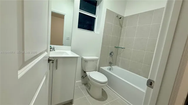 an empty room with an entrance to other room