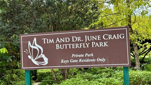 a view of a house with a tree in the park