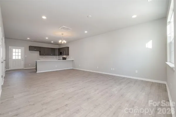 a view of a kitchen with a sink and microwave