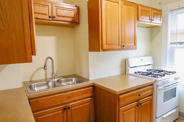 a kitchen with a stove and a sink