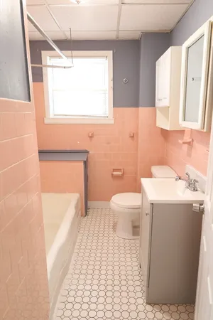 a bathroom with a sink a toilet and a bathtub