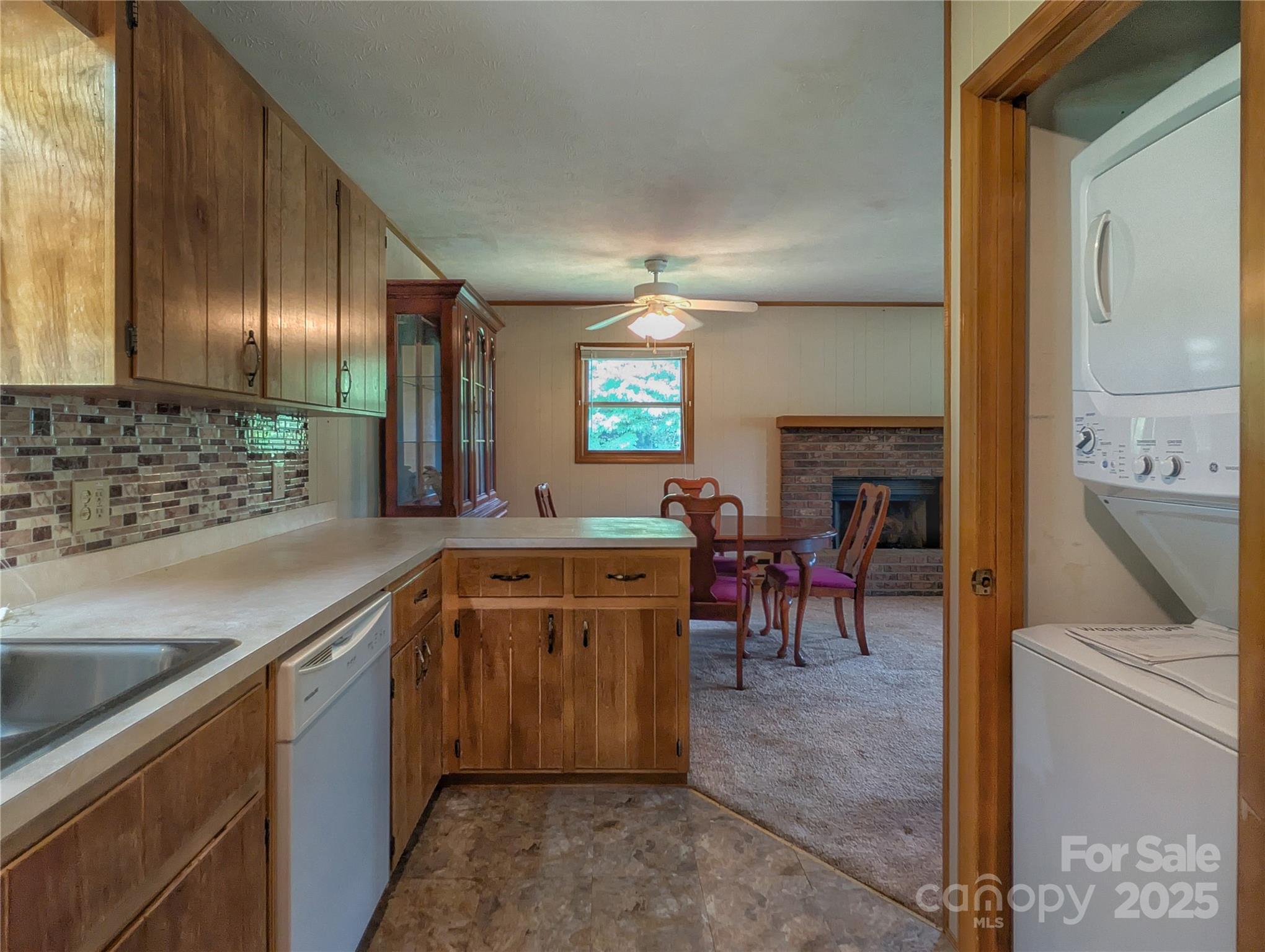 84 Stoney Ridge Loop Maggie Valley, NC 28751 - Photo 14 of 27 a kitchen with a sink stove and cabinets