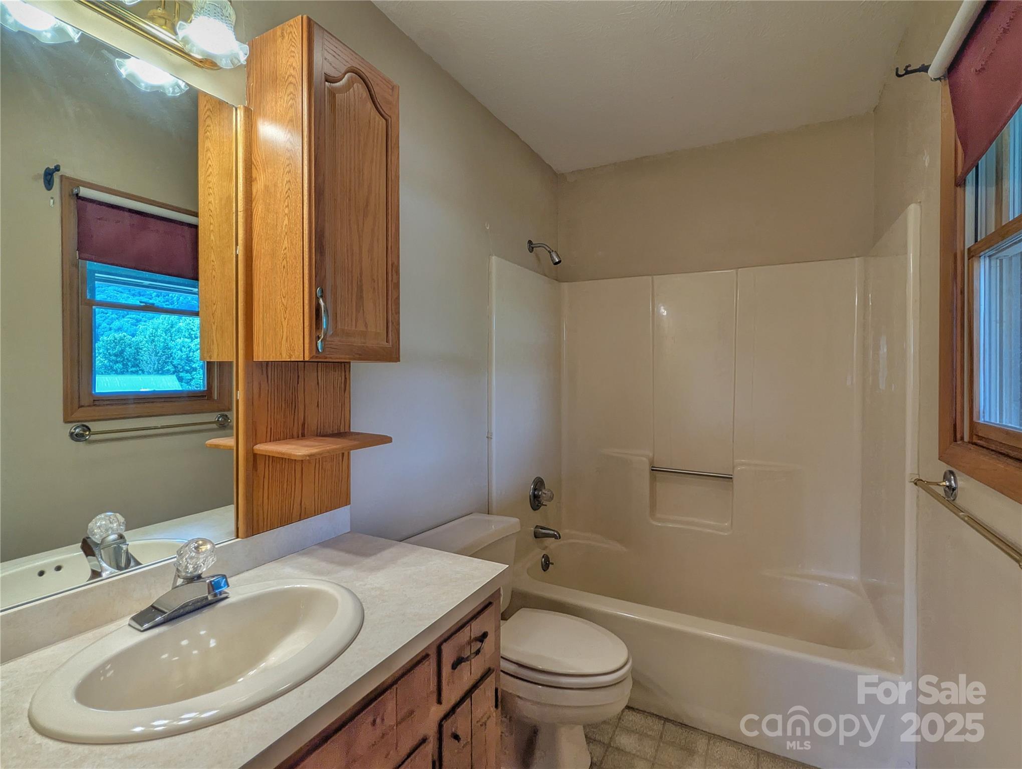 84 Stoney Ridge Loop Maggie Valley, NC 28751 - Photo 22 of 27 a bathroom with a sink toilet and shower