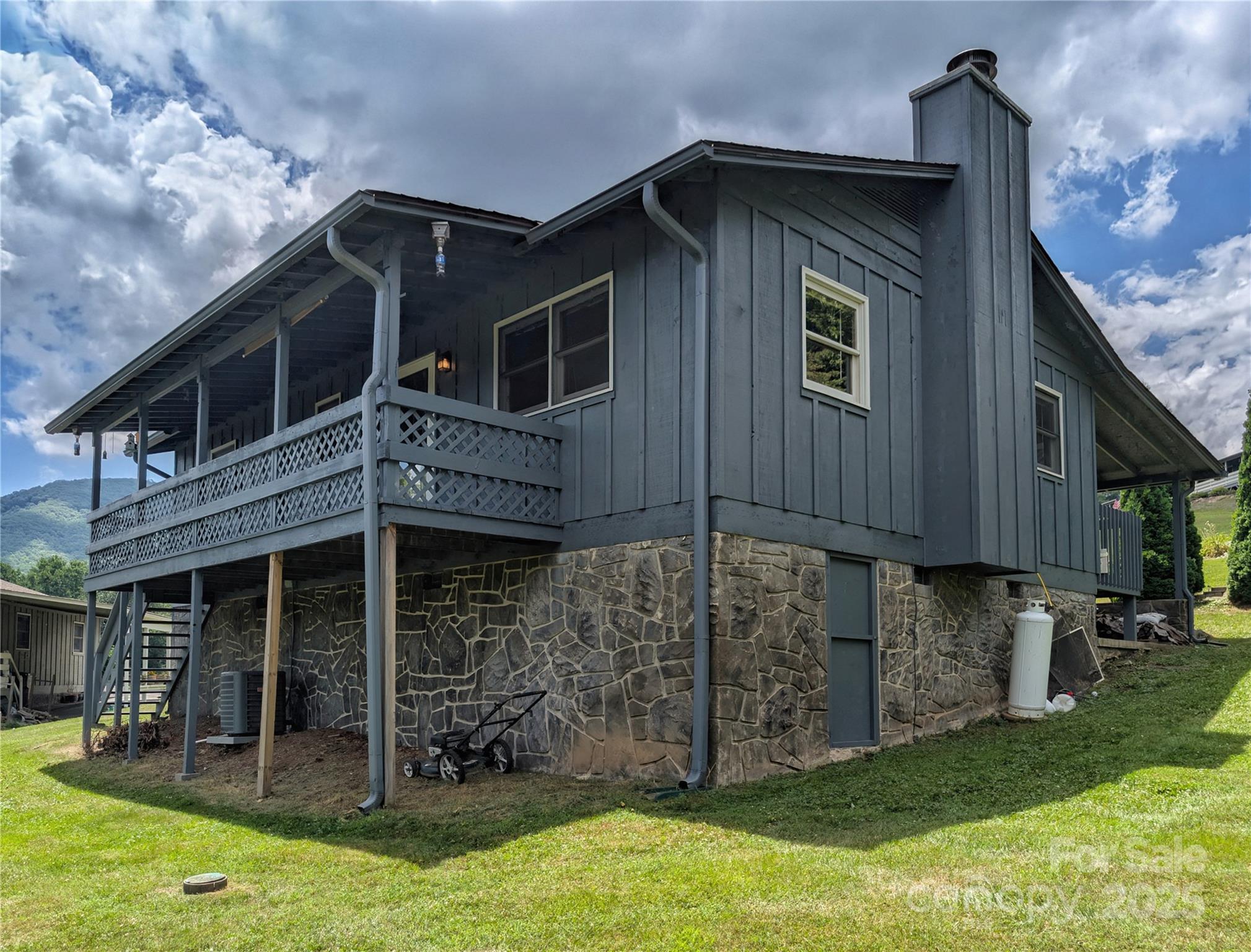 84 Stoney Ridge Loop Maggie Valley, NC 28751 - Photo 27 of 27 a front view of a house with garden