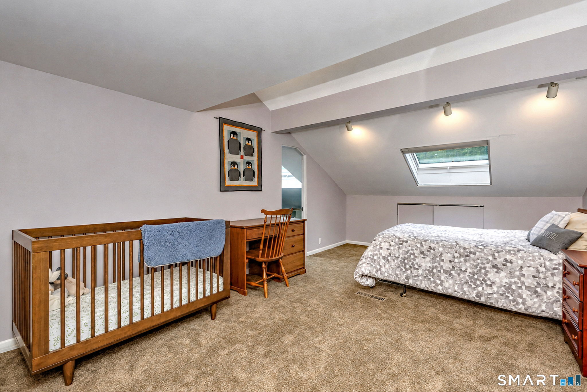25 Milan Road Woodbridge, CT 06525 - Photo 24 of 40 a bedroom with furniture and a window