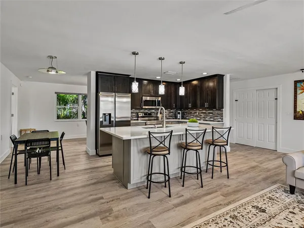 a kitchen with cabinets and stainless steel appliances