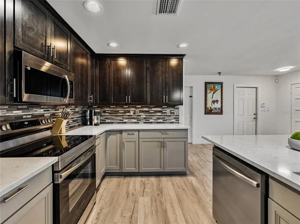 a view of a dining room with furniture and a window