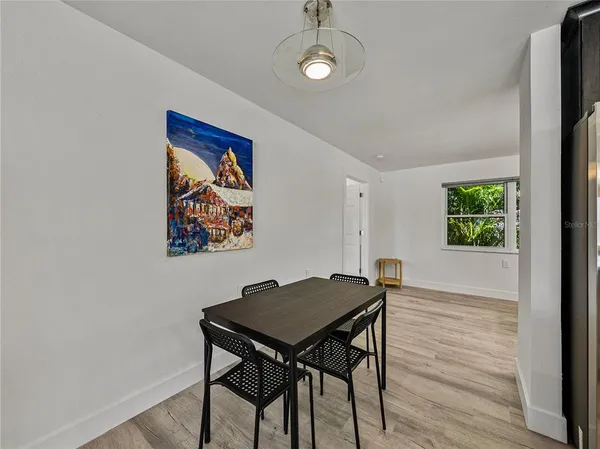 a view of a dining room with furniture window and outside view