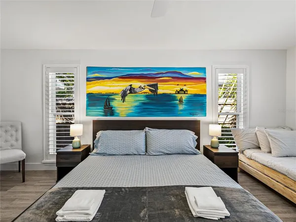 a spacious bathroom with a toilet sink and mirror