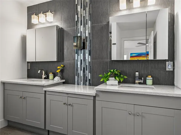 a bathroom with a shower a toilet and a sink