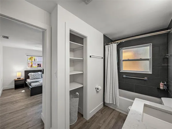 a view of a livingroom with a chair and a fireplace