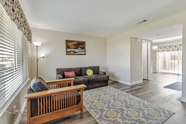 a living room with furniture and a window