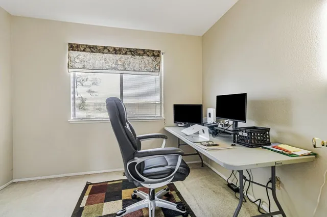a view of a workspace with furniture