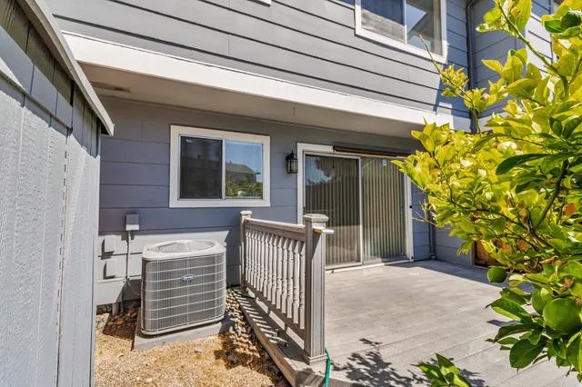 a view of house with backyard and a porch