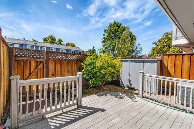 a view of outdoor space with deck and wooden floor