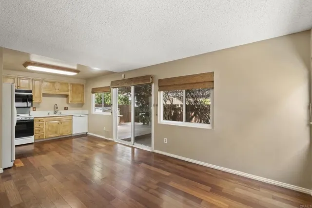 a view of a kitchen cabinets and wooden floor