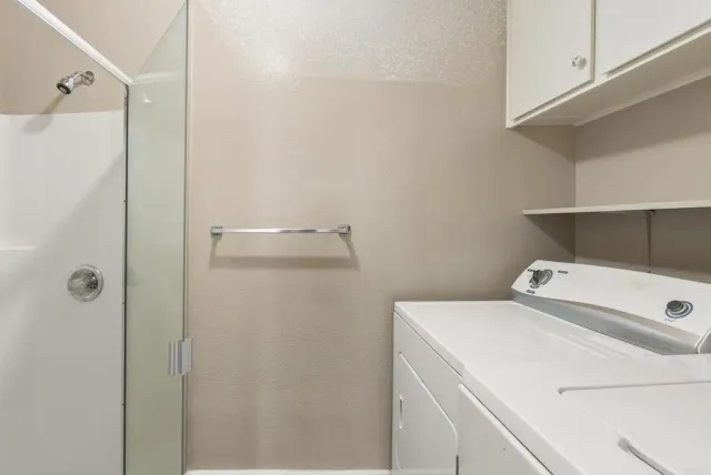 a utility room with dryer and washer
