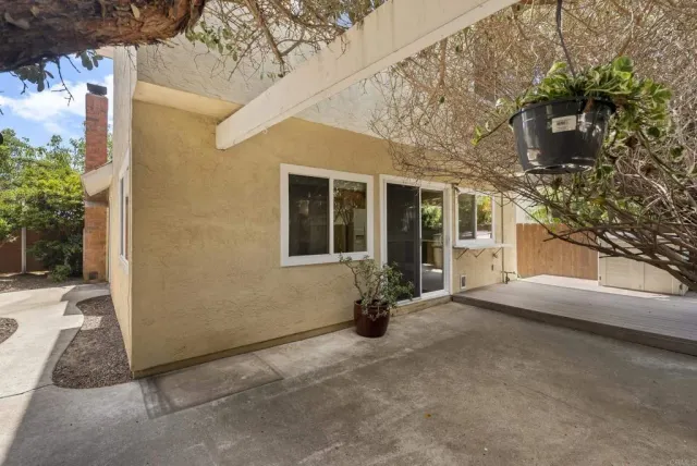 a view of a house with a snow in the yard