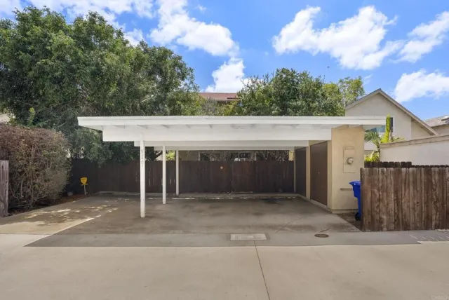 front view of a house with a garden