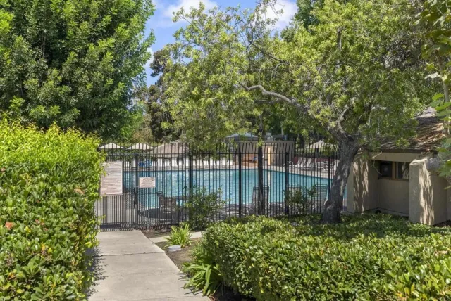 a view of a swimming pool with a patio