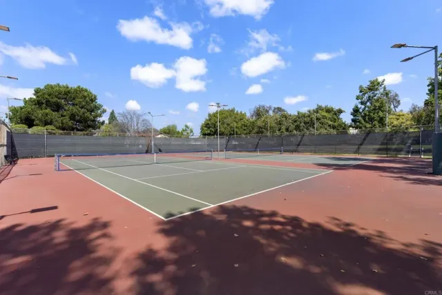a view of a street with a building in the background