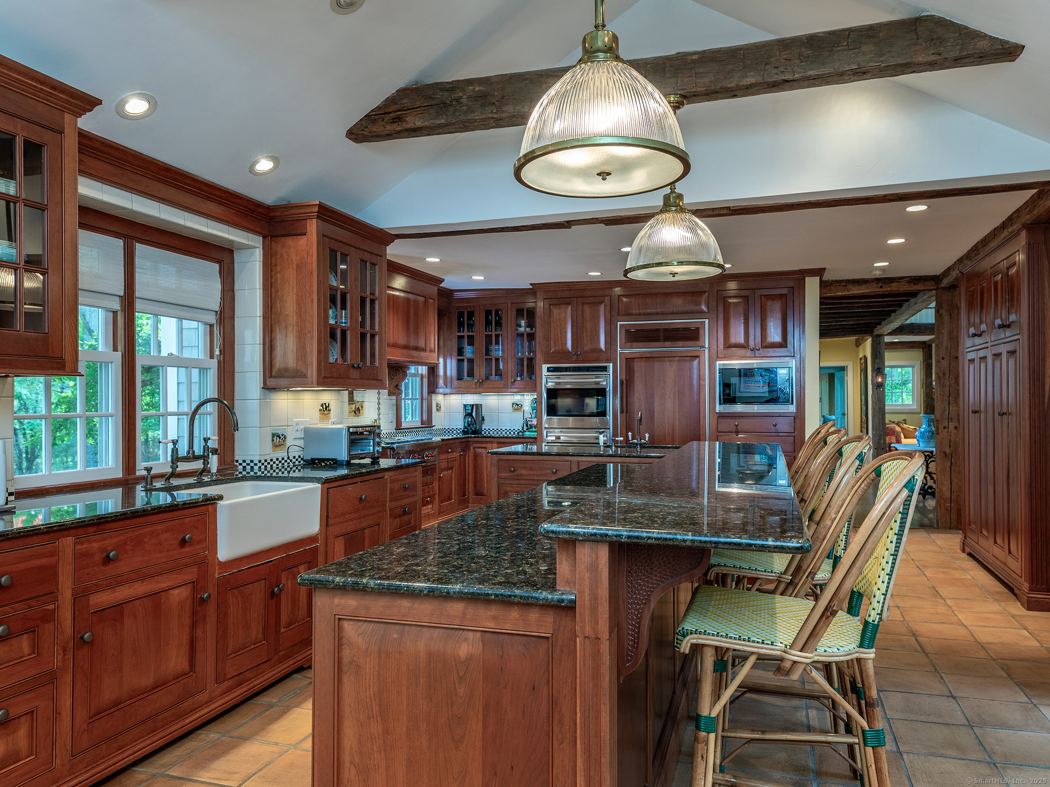 88 Rucum Road Roxbury, CT 06783 - Photo 17 of 35 a kitchen with stainless steel appliances granite countertop a sink a stove and a wooden floors