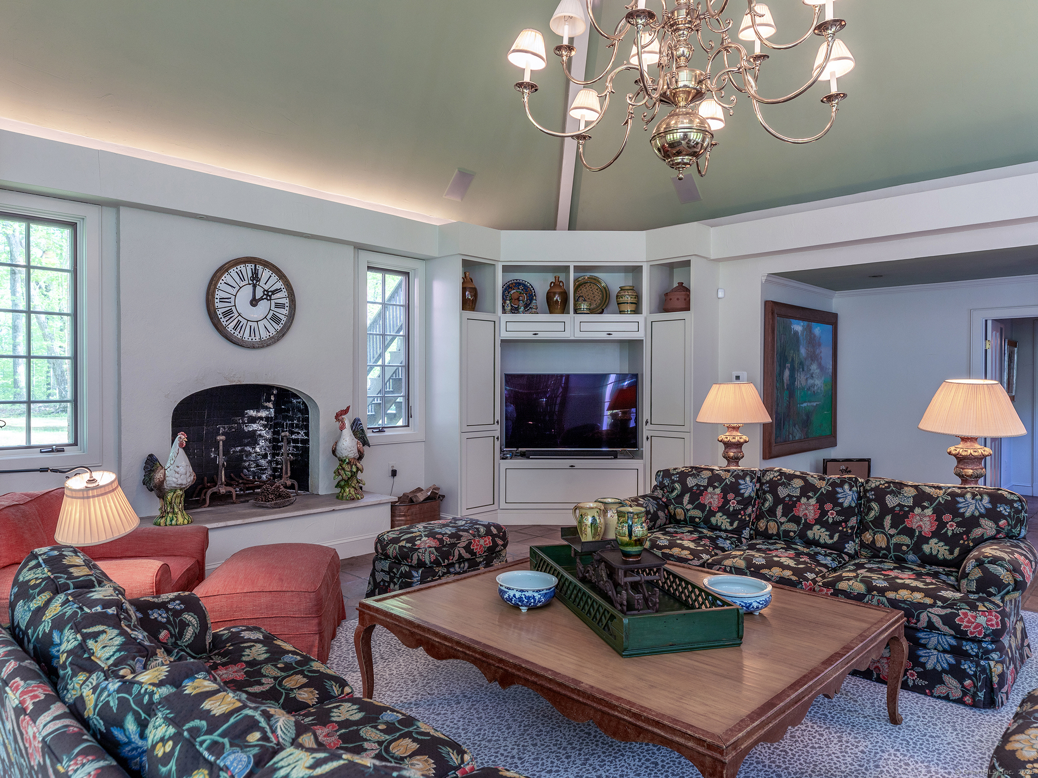 88 Rucum Road Roxbury, CT 06783 - Photo 20 of 35 a living room with furniture a rug and a flat screen tv