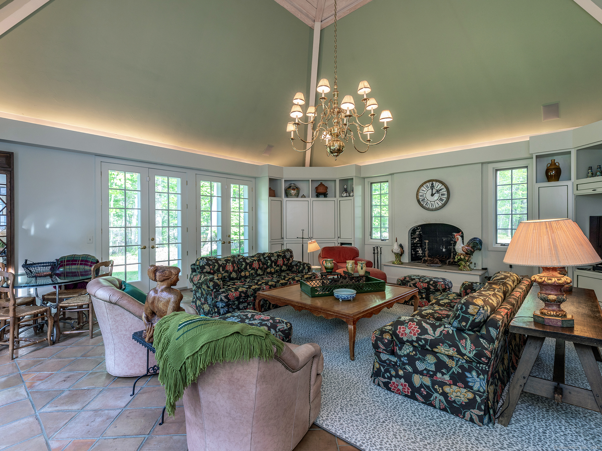 88 Rucum Road Roxbury, CT 06783 - Photo 21 of 35 a living room with furniture a chandelier and a fireplace