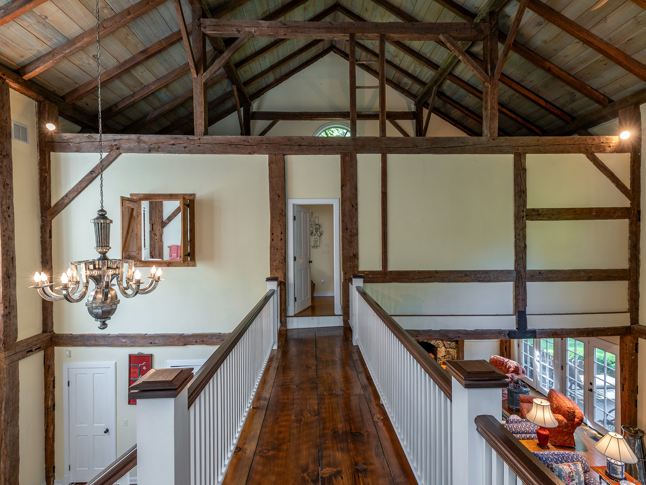 88 Rucum Road Roxbury, CT 06783 - Photo 26 of 35 a hallway with wooden floor and furniture