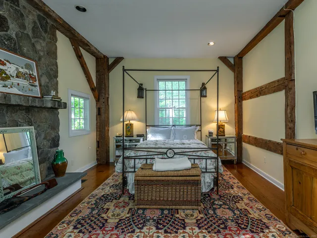 a living room with furniture windows and a fireplace