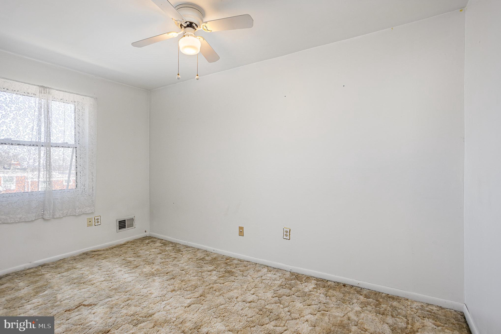 1408 Locust Street Curtis Bay, MD 21226 - Photo 12 of 25 wooden floor in an empty room with a window