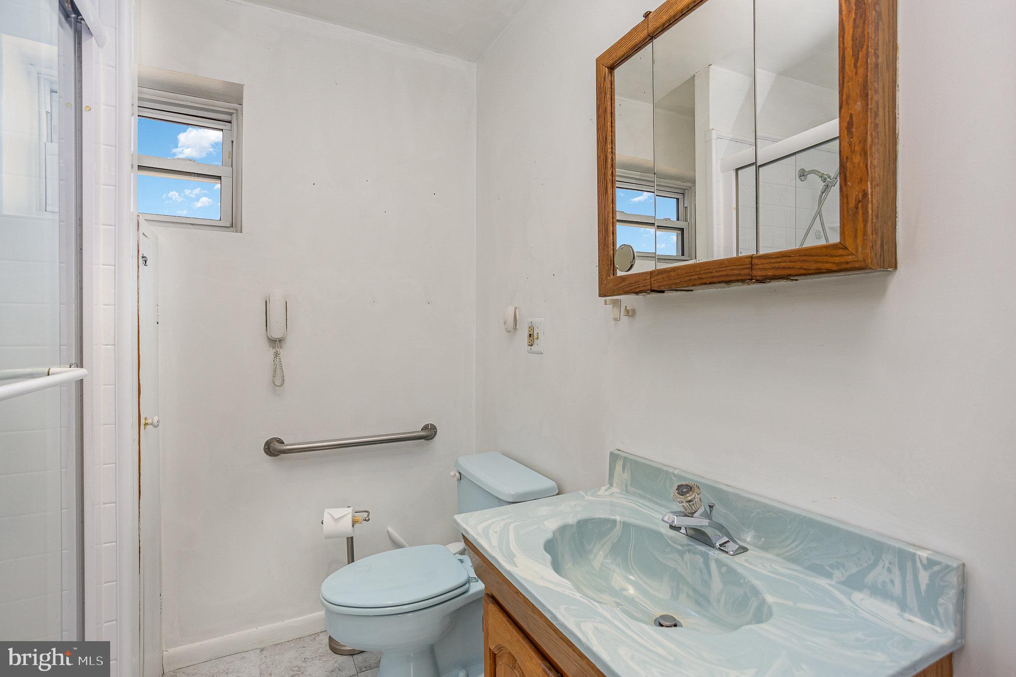 1408 Locust Street Curtis Bay, MD 21226 - Photo 14 of 25 a bathroom with a sink toilet and mirror