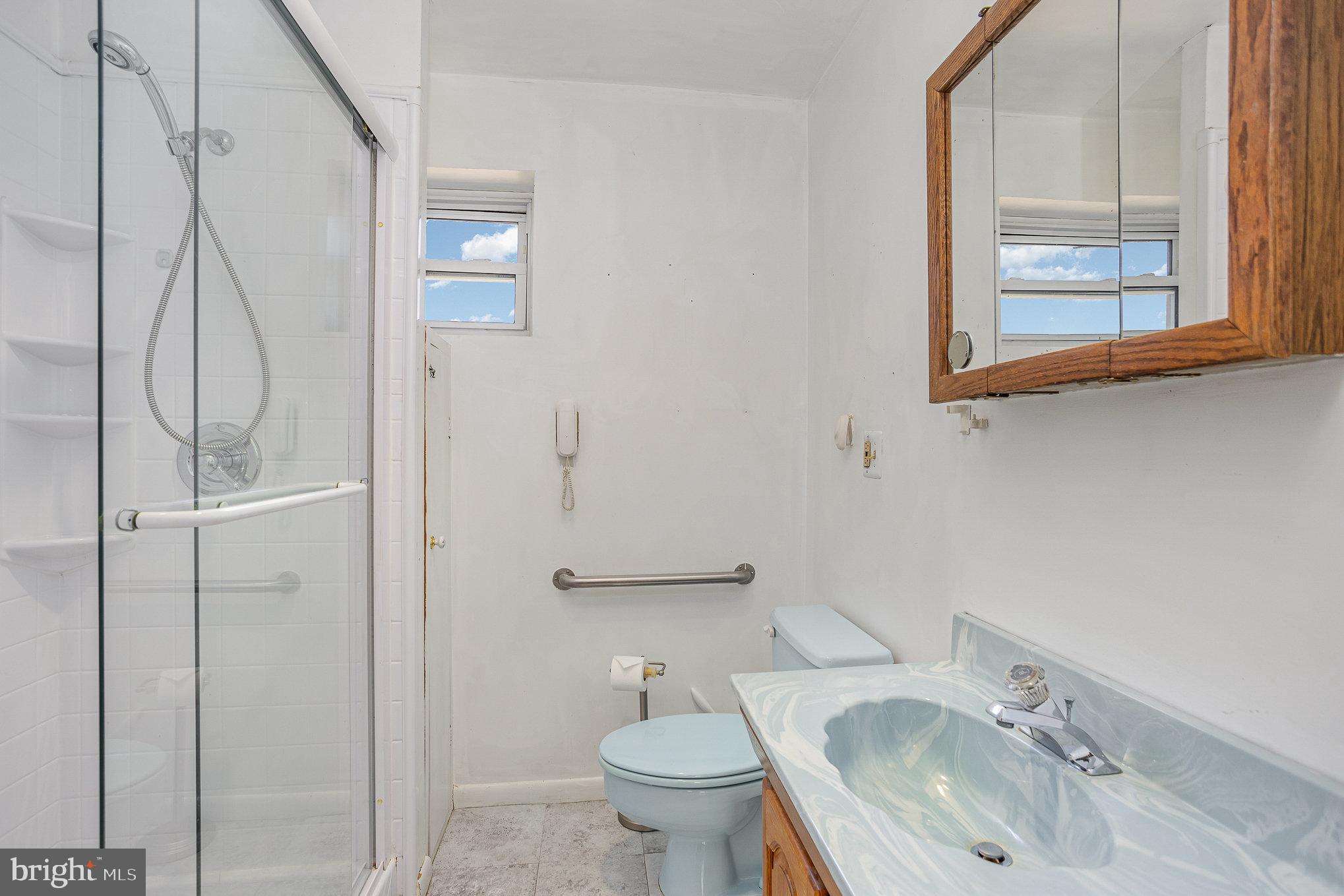 1408 Locust Street Curtis Bay, MD 21226 - Photo 15 of 25 a bathroom with a sink toilet and shower
